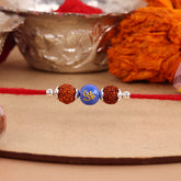 Dual Rudraksha With Blue Om Bead Silver Rakhi